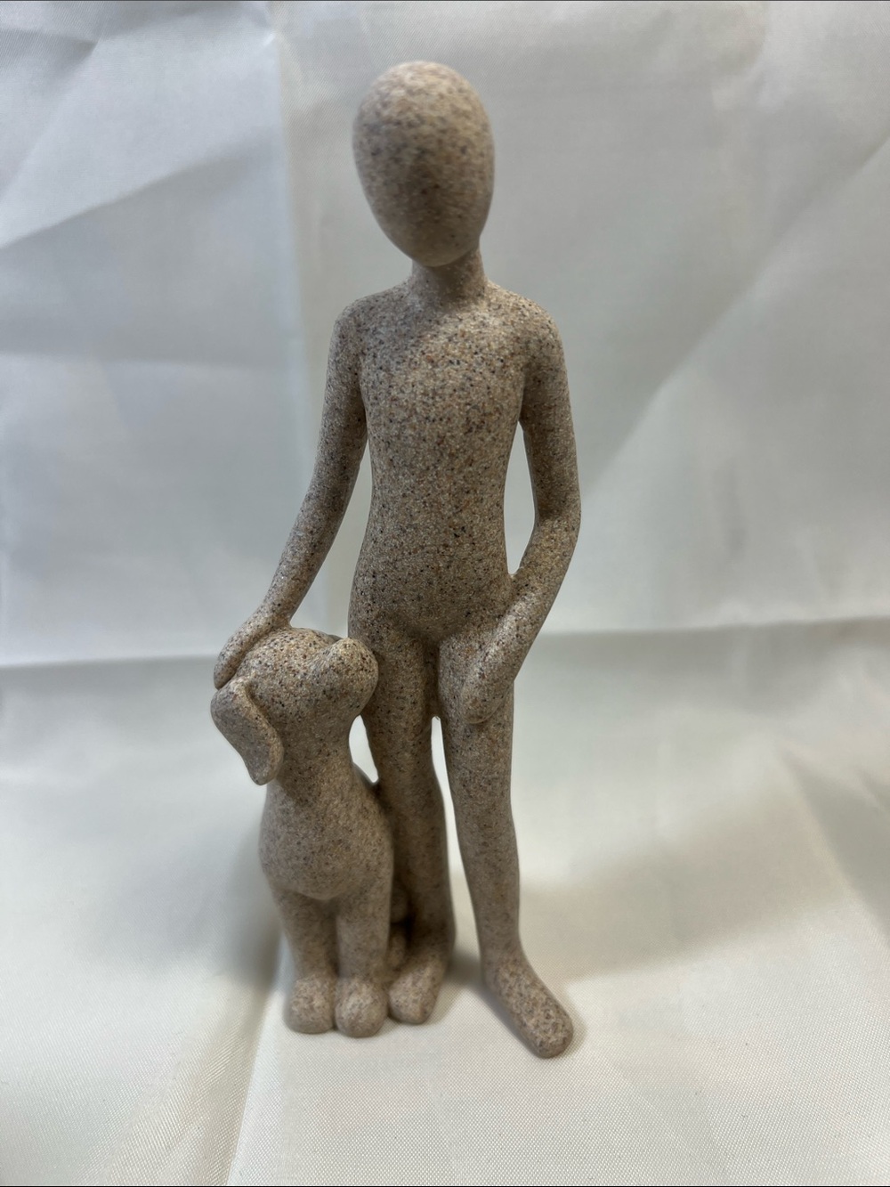 Neutral Speckled Figurine of Person with Dog